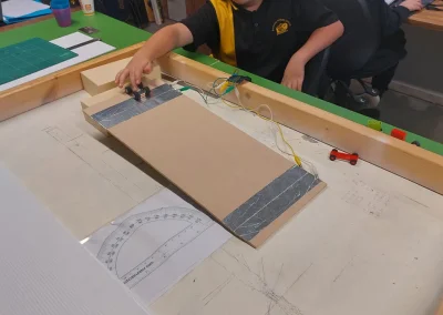 Student adjusting electronic ramp project