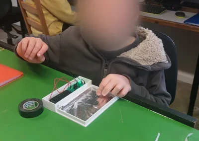 Student assembling 3d printed electronics project