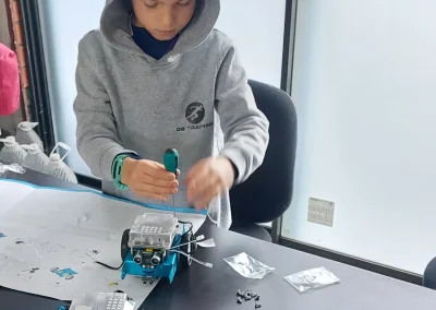 Student assembling mbot robot