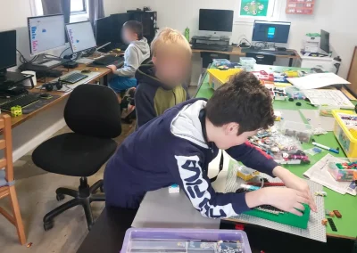 Student building lego robot