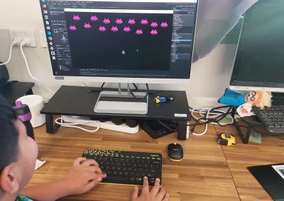 Student building space invaders game