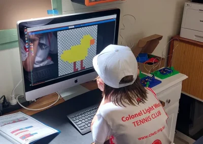 Student creating pixel art character