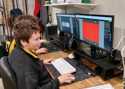 Student designing game sprite in piskel