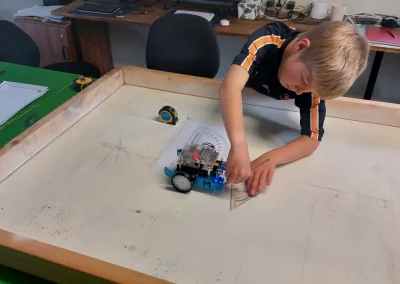 Student measuring mbot turning angle