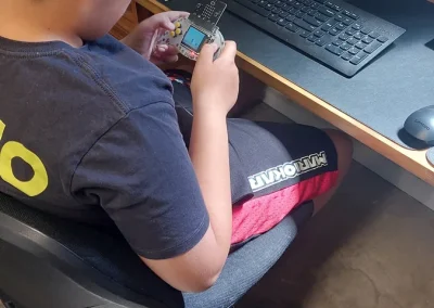 Student playing makecode arcade game