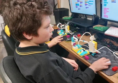 Student programming lego spike robot