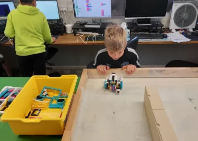 Student testing robot obstacle course