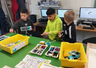 Students assembling robotics kits