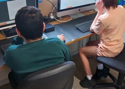 Students collaborating on game code