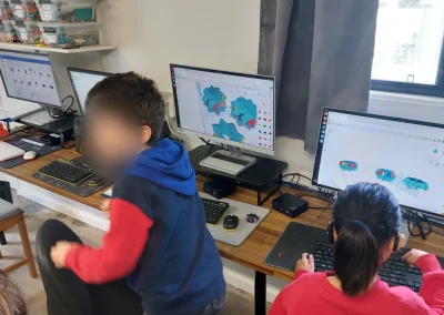 Students creating 3d models in cad software