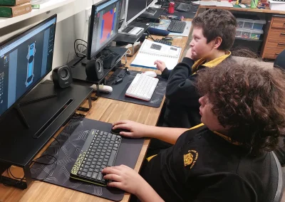 Students creating pixel art game sprites