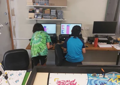 Students programming robots together