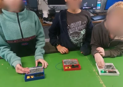 Students showing 3d printed electronics projects